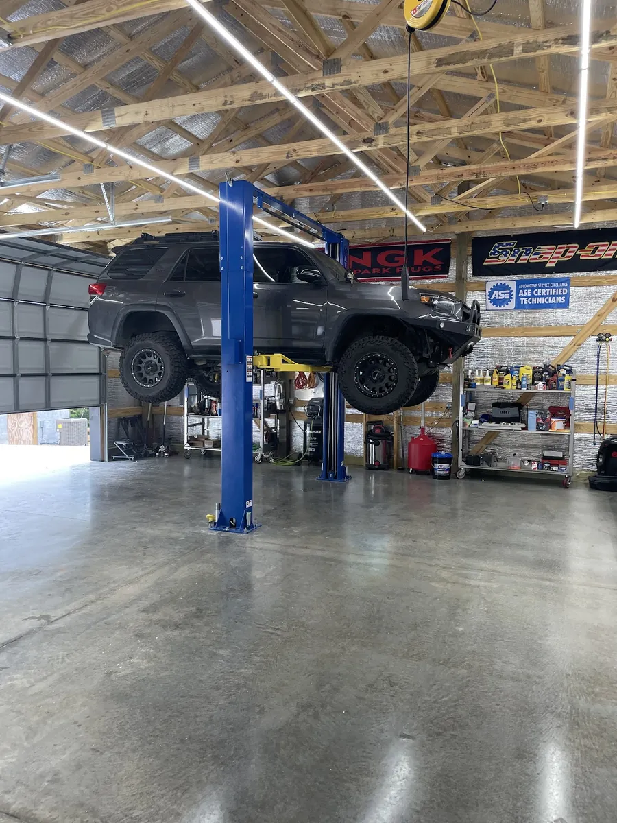 A truck up on the lift in the MPG Automotive bay.